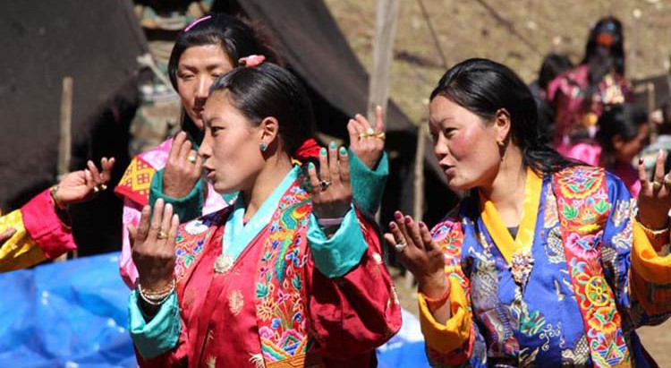 Women sing and dance at the festival